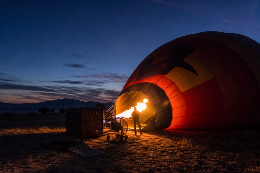 Balloon envelope inflating on the launch field near San Martin de las Piramides before sunrise